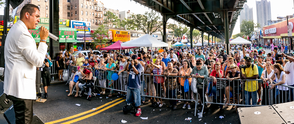 A LARGE CROWD gathers by Jerome Avenue and Gun Hill Road to hear live music at the BID's 14th annual Fall Festival. 