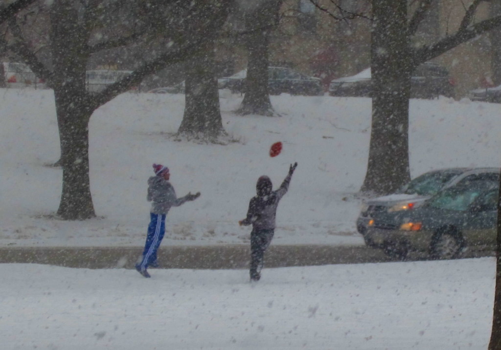 YOUNGSTERS BRAVE THE temperatures with a friendly game of football on Mosholu Parkway. Photo by David Cruz 