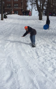 THIS SNOWBOARDER HANGS ten on Mosholu Parkway.  Photo by David Cruz 