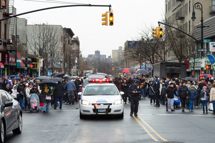 POLICE SLOWLY LEAD the procession on Bainbridge Avenue. Photo by Jenny Sharp