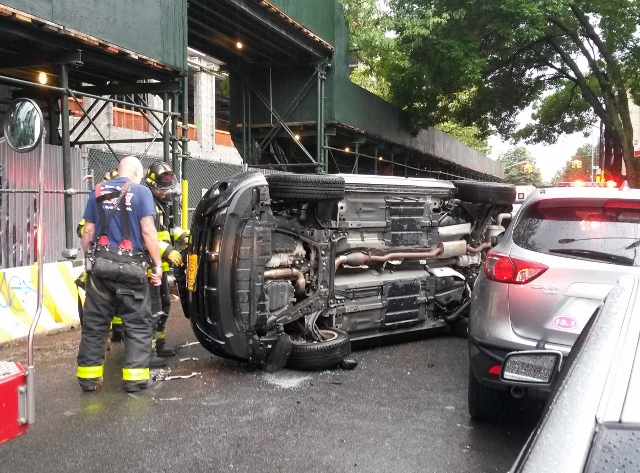 THIS OVERTURNED VEHICLE lies in front of a construction site at PS 56. The accident happened on May 31.  Photo courtesy Jay Shuffield  