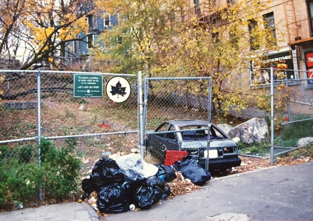 THIS PHOTO TAKEN circa 2000 shows a car abandoned at Oliver Place and Decatur Avenue. Community residents have long pressed for the space to become a park.  Photo courtesy Norwood News 