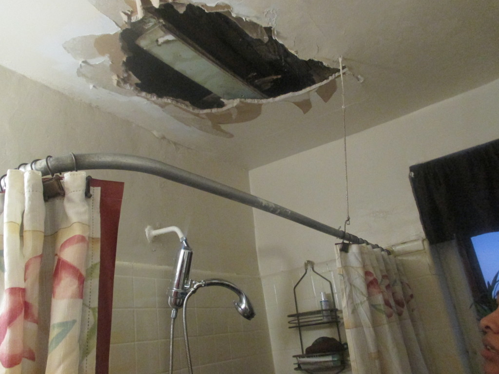 A GAPING HOLE rests above the bathroom of tenant on Creston Avenue. Photo by Jasmine Gomez