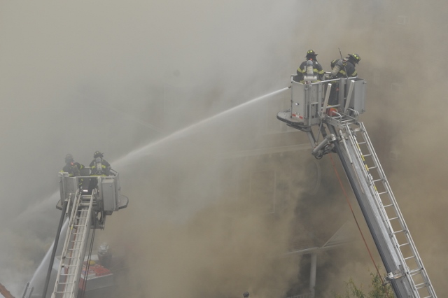 A CLOUD OF SMOKE engulfs fire crews fighting the blaze. Photo by David Cruz 