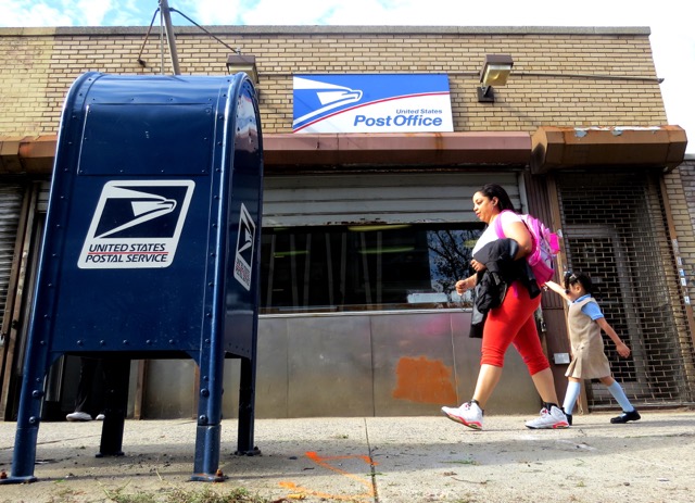 THE 2963 WEBSTER AVE. Post Office has been in Bedford Park for decades. For the past few years its future has always been up in the air.  Photo by David Cruz 