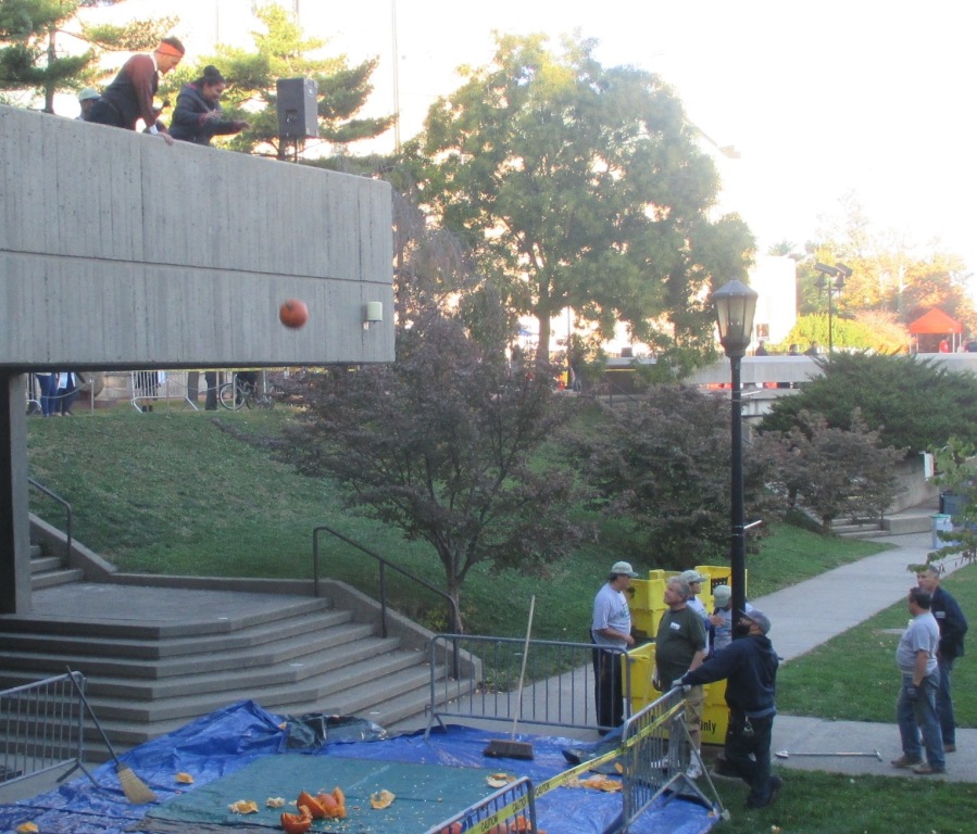 PUMPKIN SMASH! Participants at the Pumpkin Smash event hosted by NYC Compost Project drop a pumpkin from atop a Lehman College building Nov. 4. Photo by Vivian Carter