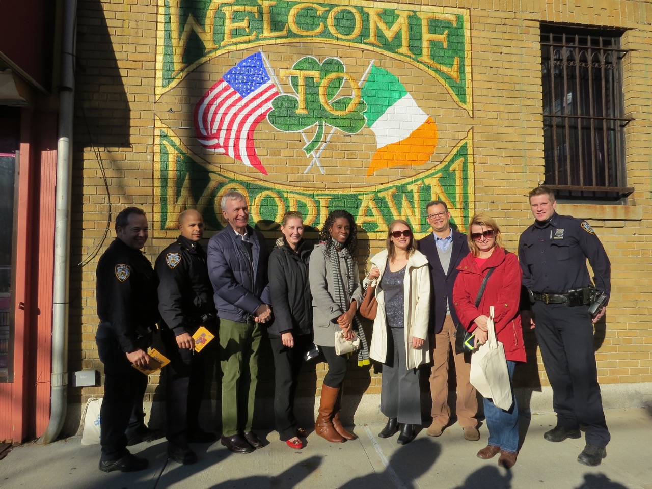 A DIFFERENCE FUNDING MAKES. Community stakeholders, including the Women of Woodlawn civic group, stand in front of mural made possible through funds from Citizens Committee for New York City.  Photo by Vivian Rattay Carter  