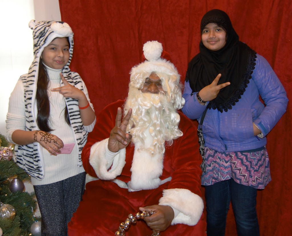 SANTA AND HIS two visitors convey a message of peace. Photo by Miriam Quinones