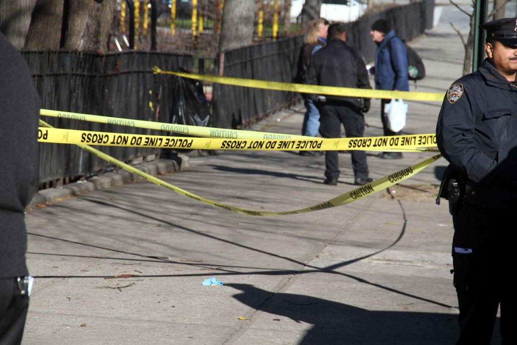 The victim was shot in the back and ran a short distance before collapsing outside of Devoe Park.--Photo by David Greene